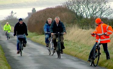 Cyclists riding around Stronsay