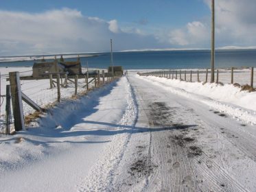 Visit Stronsay in winter Snowy track overlooking St. Catherine's Bay, Stronsay